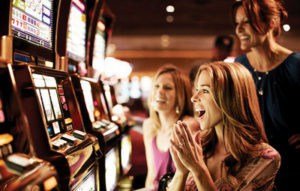 Women playing the slot machines inside MGM Grand